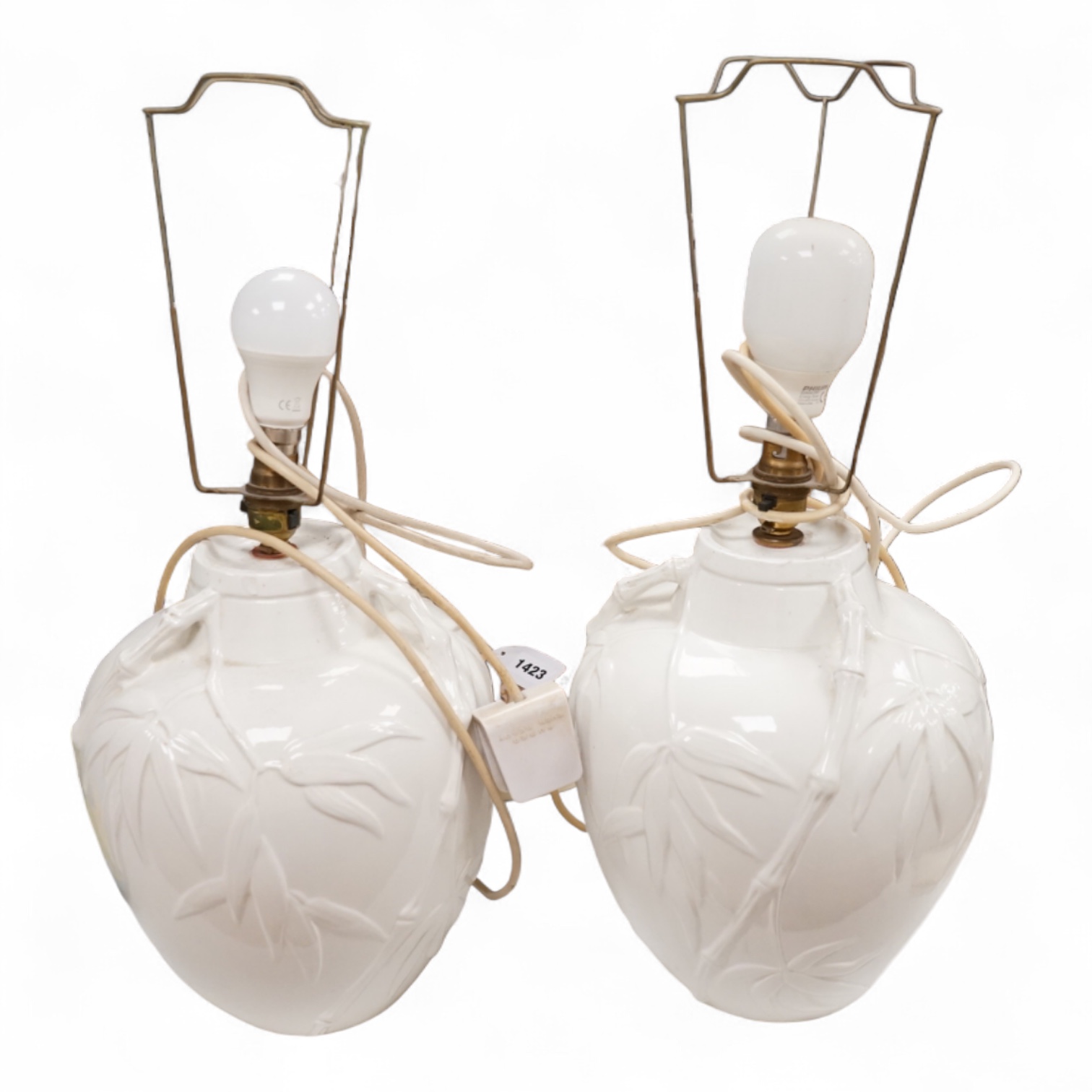 A pair of Chinese porcelain table lamps decorated with bamboo